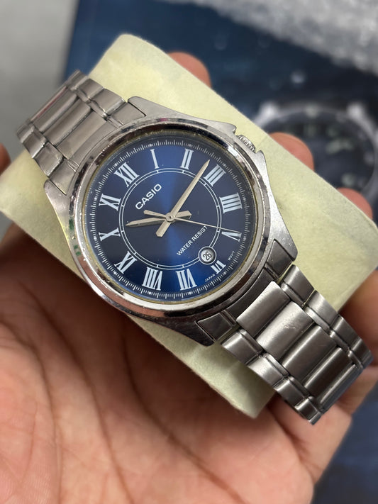 Casio MTP-1400D-2ADF Pre-owned Watch with a Midnight Blue Sunburst Dial