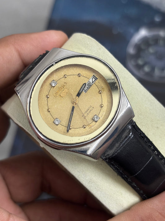 Seiko 5 Automatic Vintage Day Date Watch with an Oval-shaped Face and Golden Dial