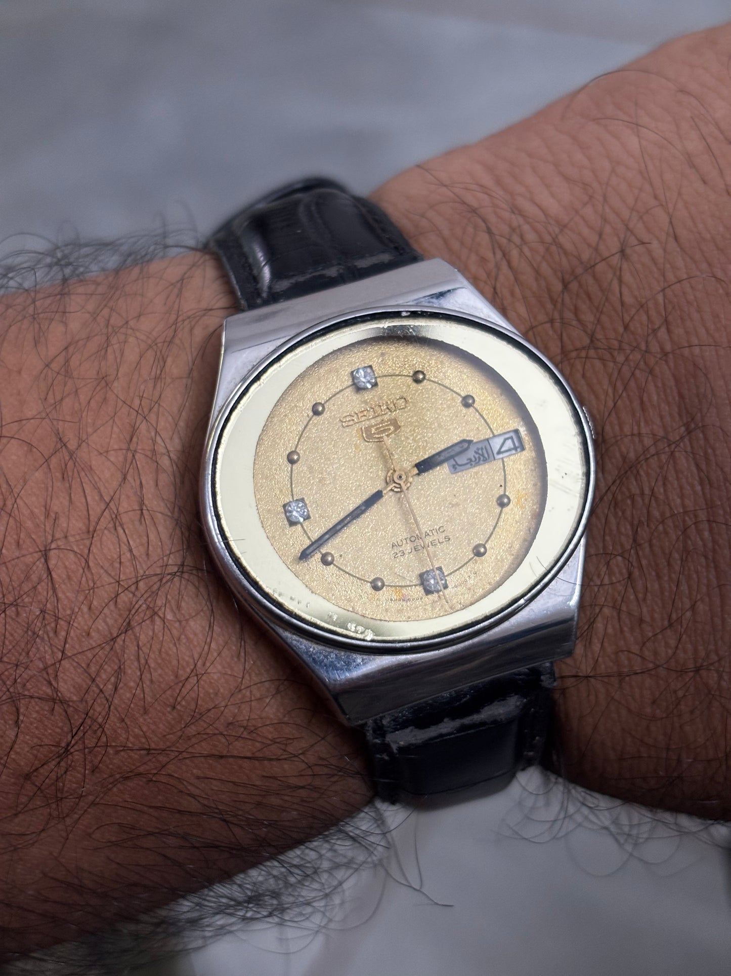 Seiko 5 Automatic Vintage Day Date Watch with an Oval-shaped Face and Golden Dial