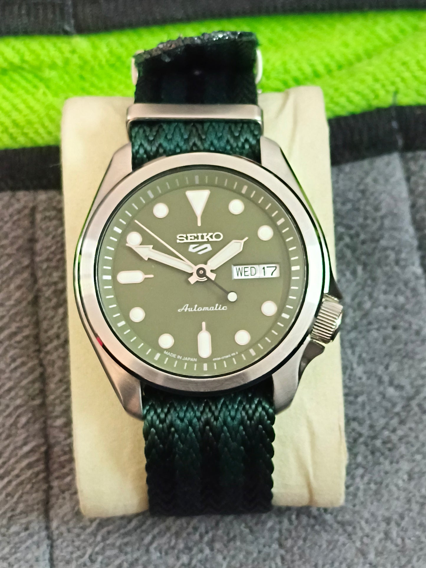 Seiko 5 Sports SKX Series Model SRPE65 with a Green Dial and Matching NATO Strap