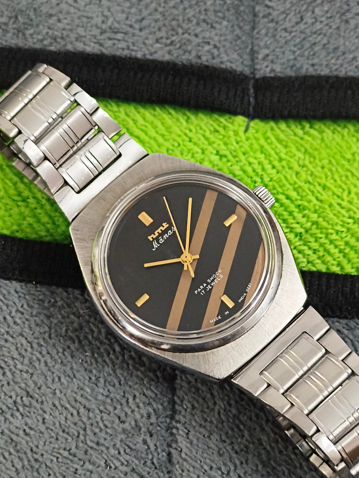 HMT Manas Hand-wound Vintage Watch with a Black Dial Featuring Golden Stripes