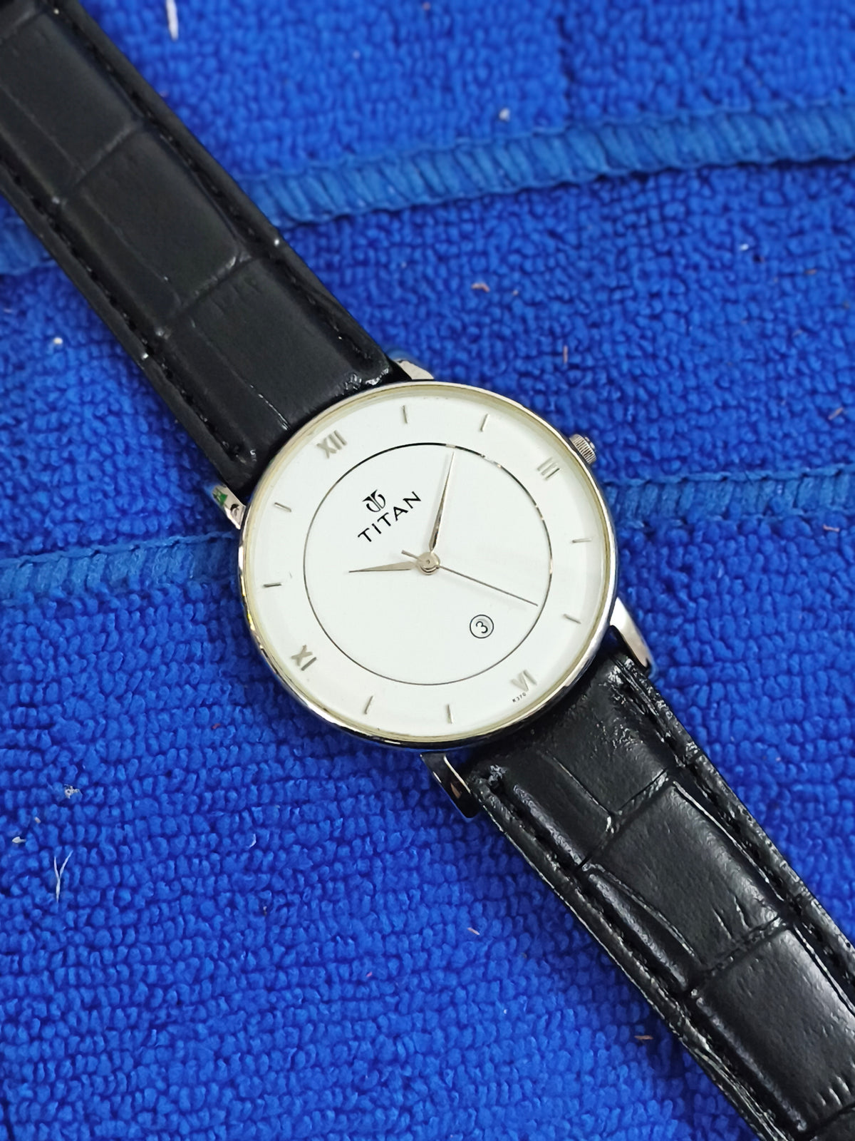 Titan Quartz watch with a White Dial and Roman Numerals