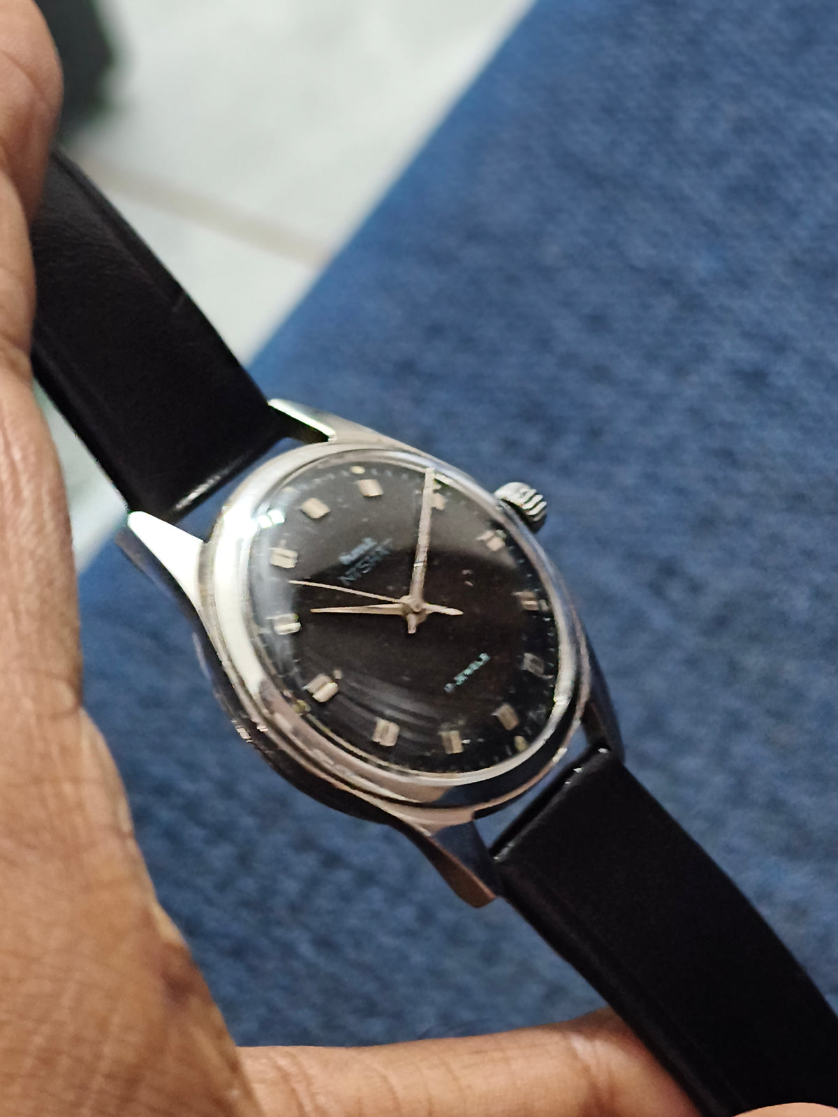 HMT Nishat Hand-wound Vintage Watch with a Black Dial and Brick Indices