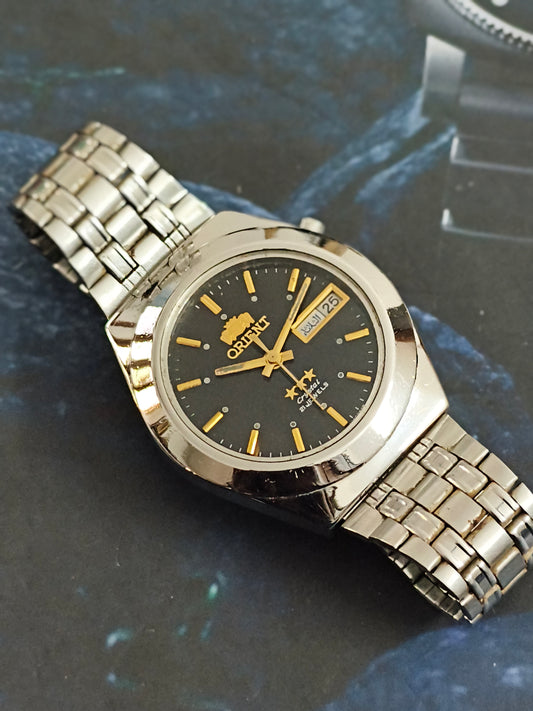 Orient "Crystal" Neo-Vintage Automatic Day Date Watch with a Black Dial and Golden Details