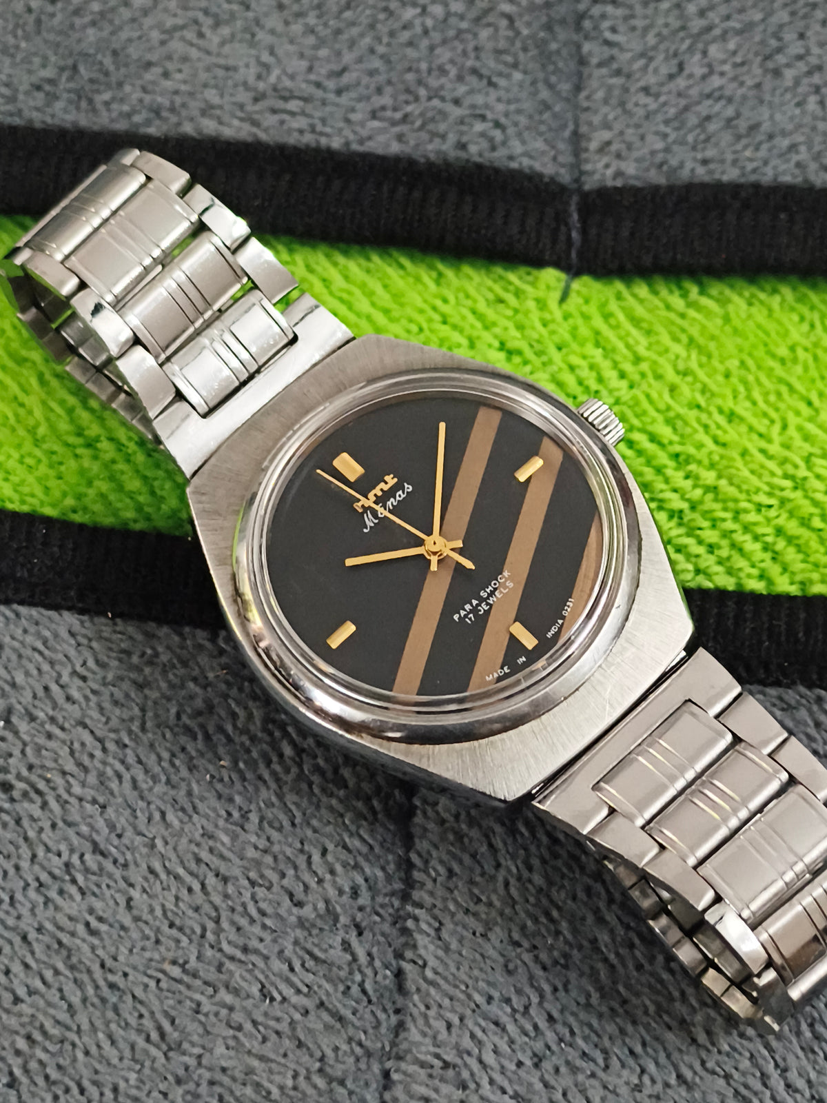 HMT Manas Hand-wound Vintage Watch with a Black Dial Featuring Golden Stripes