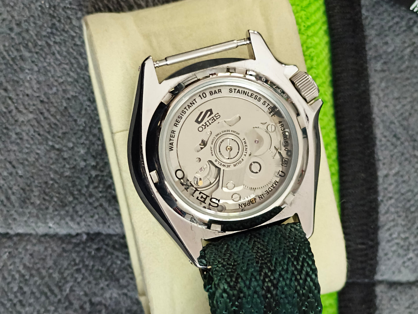 Seiko 5 Sports SKX Series Model SRPE65 with a Green Dial and Matching NATO Strap