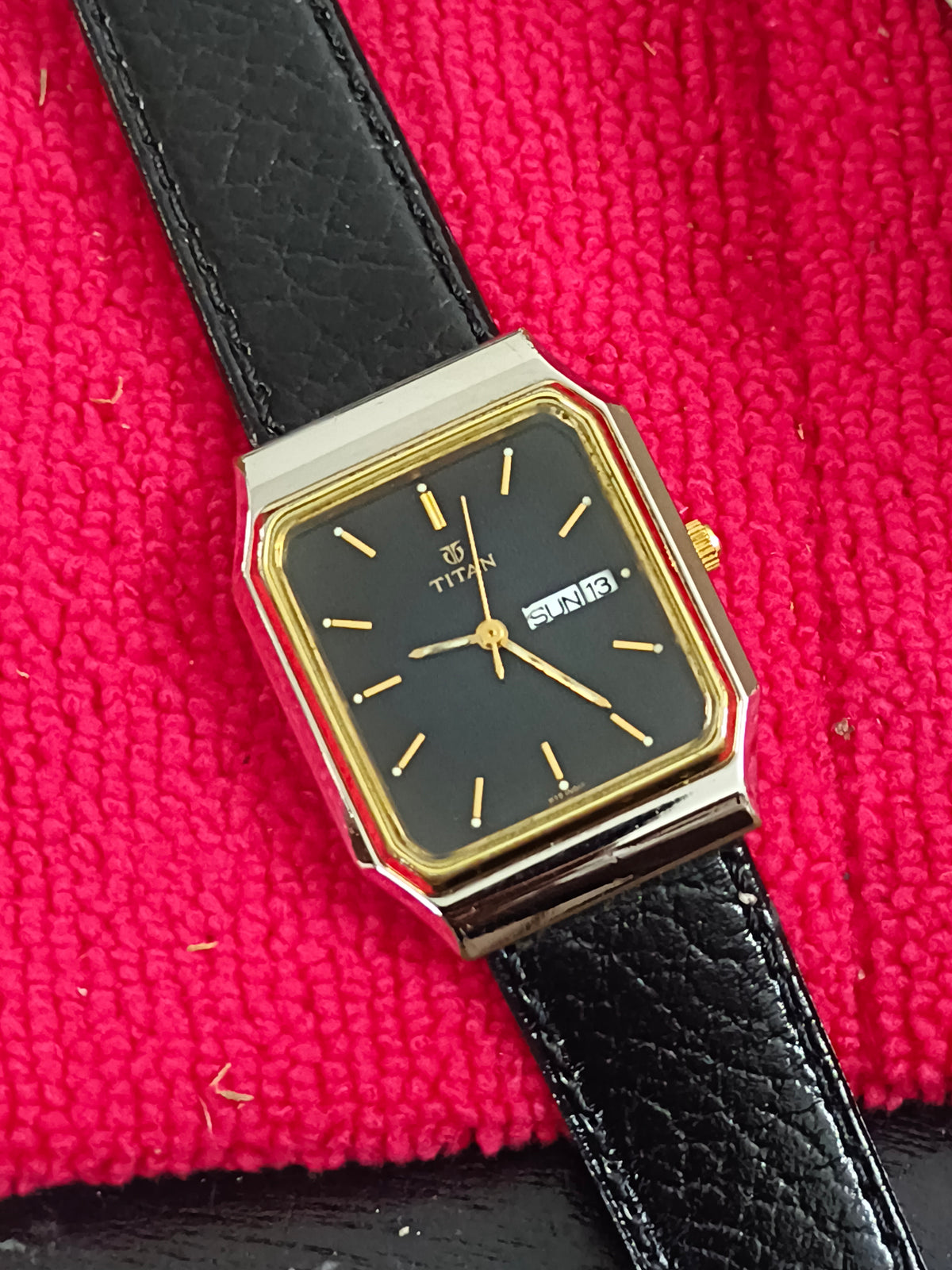 Titan Tank Quartz Day Date Watch with a Two Tone Case and Textured Black Dial