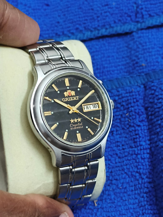 Orient Neo-Vintage Automatic Day Date Watch with a Black Dial and Golden Details