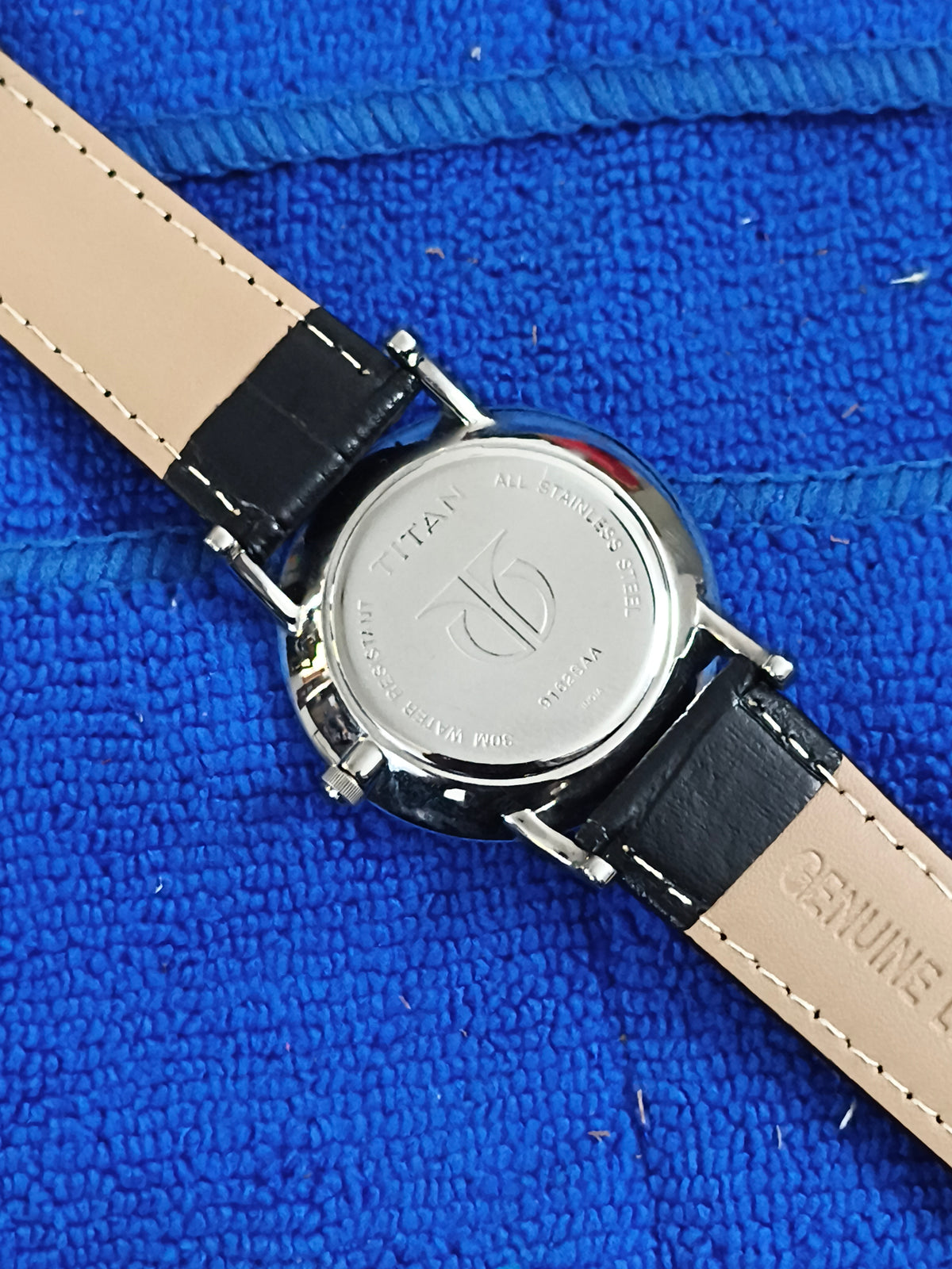 Titan Quartz watch with a White Dial and Roman Numerals