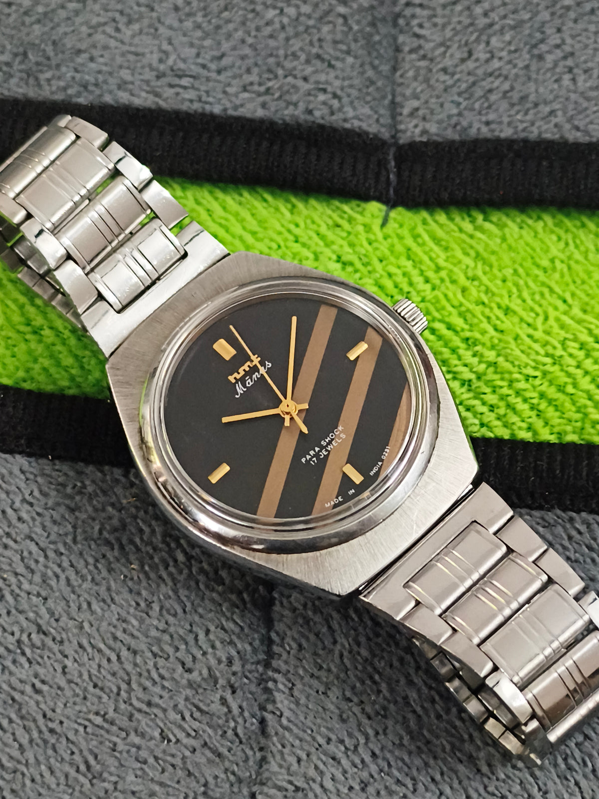 HMT Manas Hand-wound Vintage Watch with a Black Dial Featuring Golden Stripes
