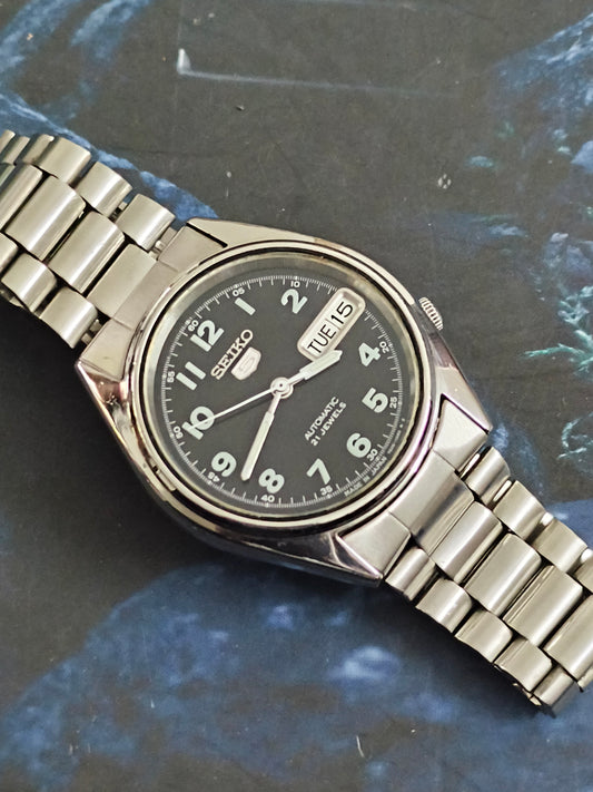 Seiko 5 Automatic Vintage Watch with a Black Dial and Luminous Arabic Numbers
